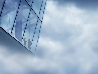 Two international workers in a high rise glass office