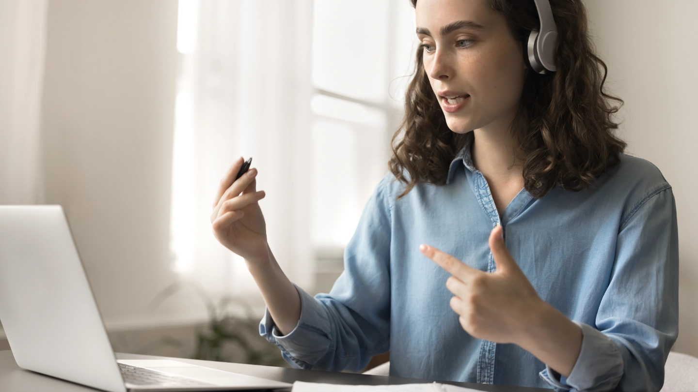 woman at laptop with a headset
