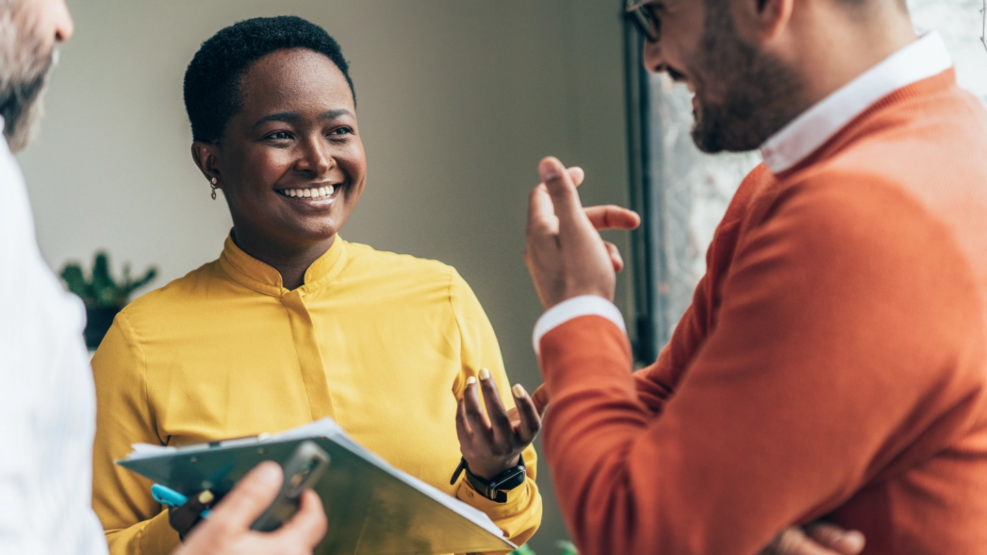 Woman and two men talking