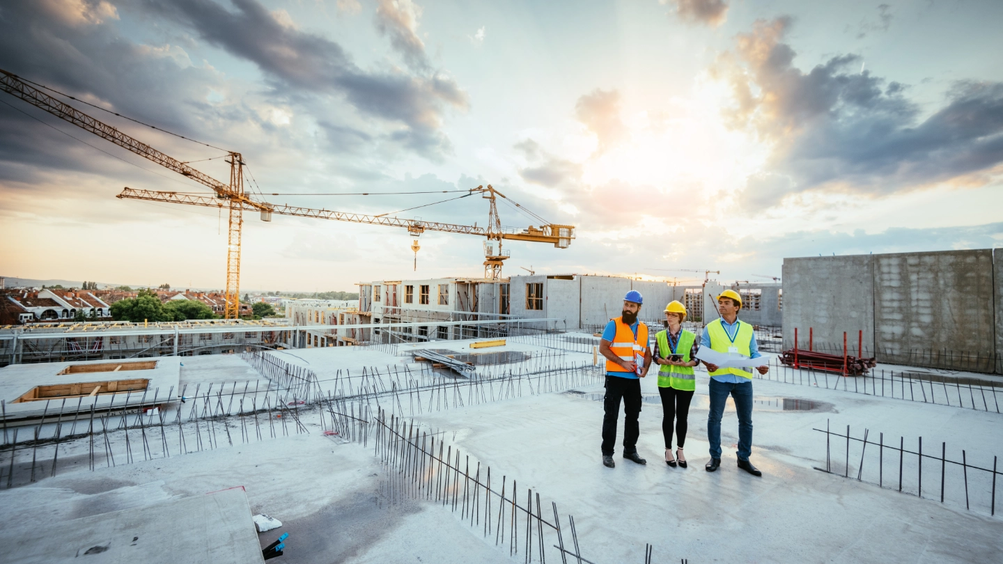 Group of construction workers on a roof top Group of construction workers on a roof top